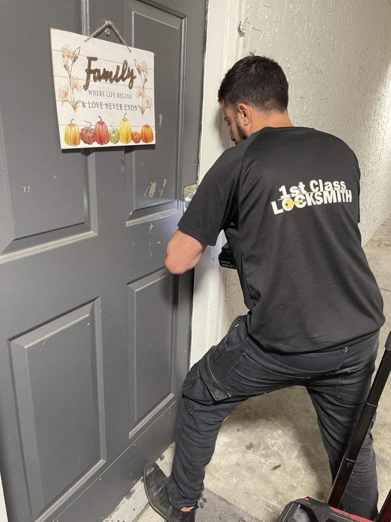 1st Class Locksmith Dallas TX, is unlocking an apartment door for our customer.