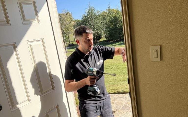 1st Class Locksmith technician repairing a front door lock that would not latch