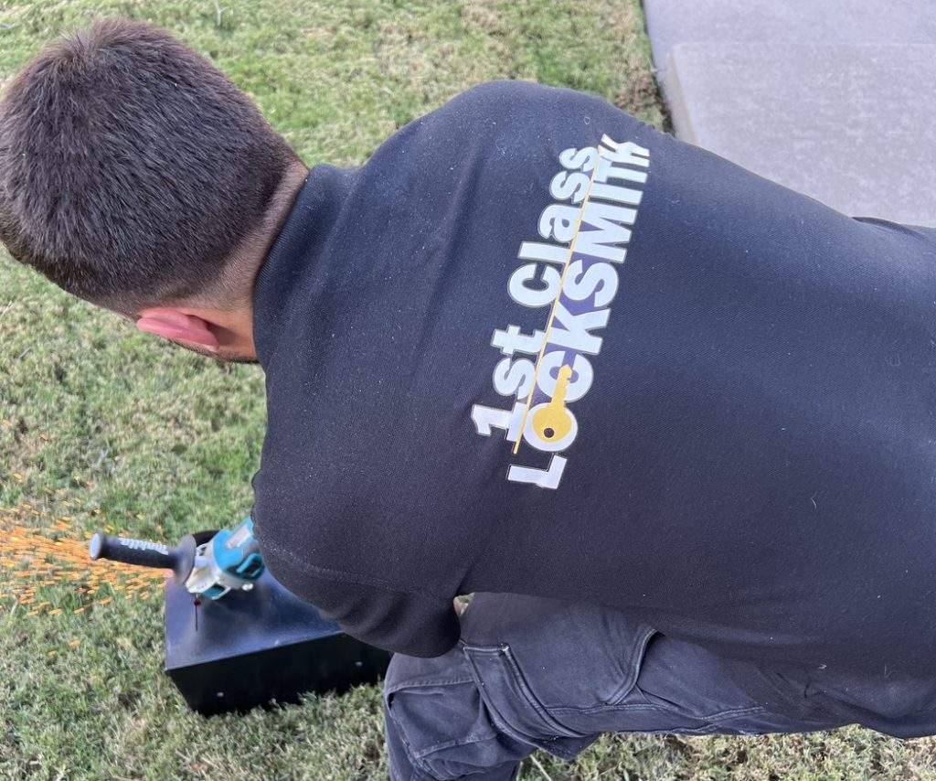 1St Class Locksmith technician unlocking a safe